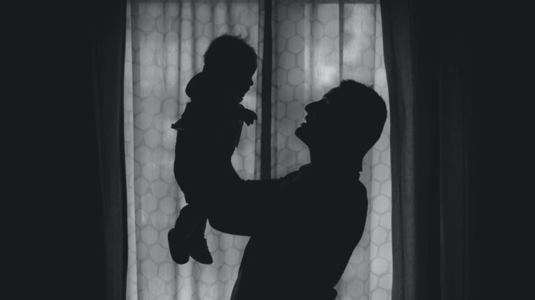 adoption parent holding child